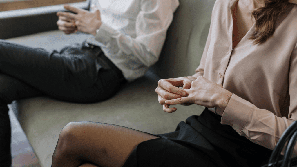 Divorced couple sitting on couch